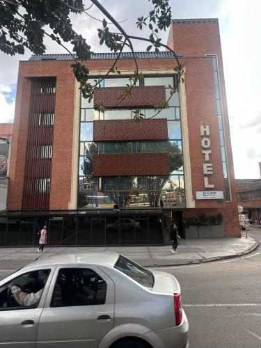 a car parked in front of a building at Lavid Hotel Palacio Real in Bogotá
