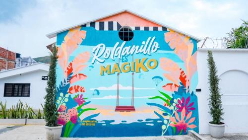 a mural on the side of a building at Magiko Suites in Roldanillo