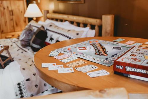 a wooden table with cards on top of a bed at Island Cove #6 -Lake Minocqua in Minocqua