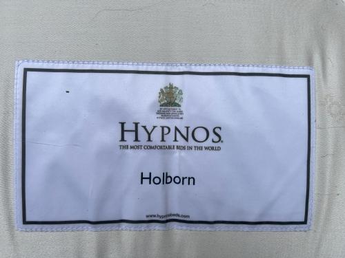 a sign on a wall with a hyrnos sign on it at VipStay - Stilvoll und geräumige Apartments mit Terasse oder Balkon, Küche, kostenloses Parken, WLAN, Smart Tv in Wiesloch
