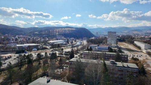an aerial view of a city with buildings and mountains at Simcity 2 I 3BR in city center w free parking, 24 7 self check-in in Banská Bystrica