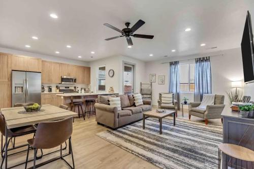 a large living room with a ceiling fan at Spacious 6-BR Retreat - Heated Pool Sleeps 16 in Santa Clara