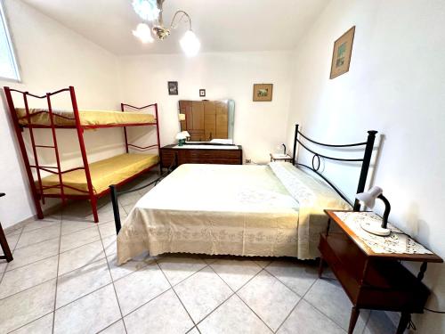 Ένα ή περισσότερα κρεβάτια σε δωμάτιο στο Villa Alghero mare 5 min