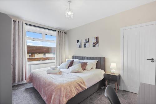 a bedroom with a bed with a teddy bear on it at 3-Bed Newcastle Home Near Airport & City Centre Free Parking in Kenton