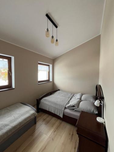 Postel nebo postele na pokoji v ubytování Luksusowy przestronny apartament