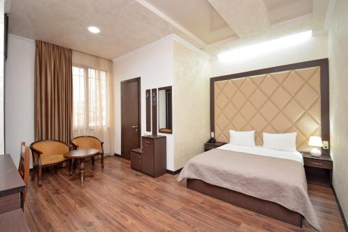 Postel nebo postele na pokoji v ubytování Partez Boutique Hotel