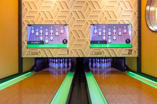 a bowling alley with a bunch of bowling pins at Grand Palladium Colonial Resort & Spa - All Inclusive in Akumal