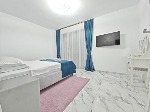 Ένα ή περισσότερα κρεβάτια σε δωμάτιο στο G&G Residence