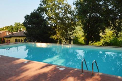 The swimming pool at or close to Tuscan Sun With Shared Pool - Happy Rentals