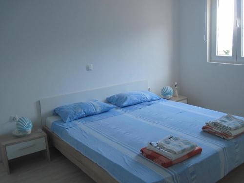 A bed or beds in a room at Apartments Rosa