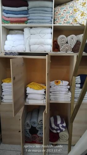 a closet filled with towels and towels at Hostel Aprisco São Paulo in São Paulo