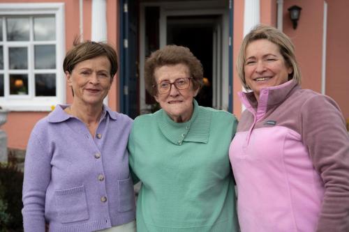 three older women standing in front of a house at Murphys Farmhouse B&B in Castlemaine