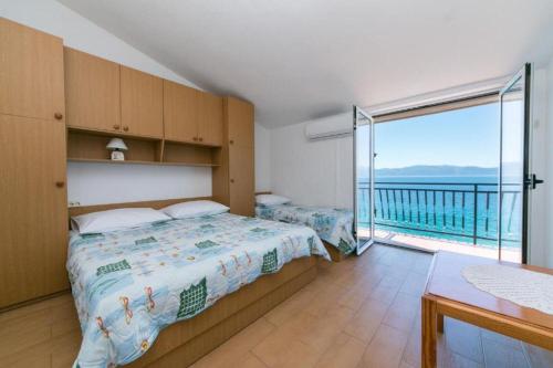 Postel nebo postele na pokoji v ubytování Apartments Gordan