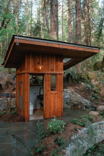 a wooden out house in the middle of a forest at Magical Yurt in the woods - 2 miles from town in Nevada City