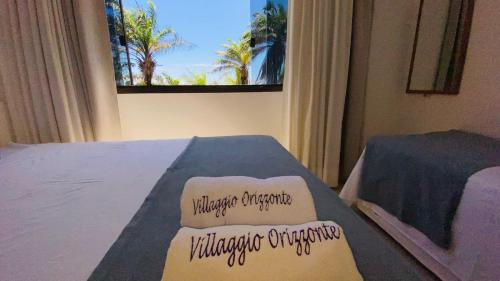 Ένα ή περισσότερα κρεβάτια σε δωμάτιο στο Villaggio Orizzonte