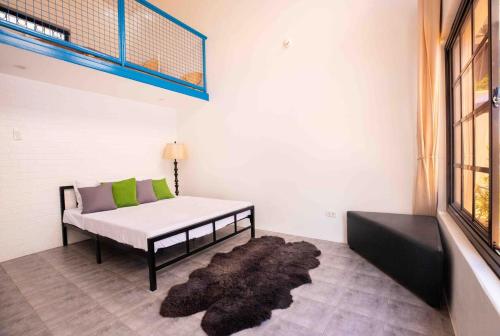 a room with a bed and a rug at Private Resort in upper Antipolo in Antipolo