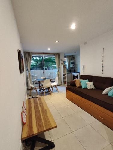 a living room with a couch and a table at La Plata - ZORZAL - Alquiler Temporal in La Plata