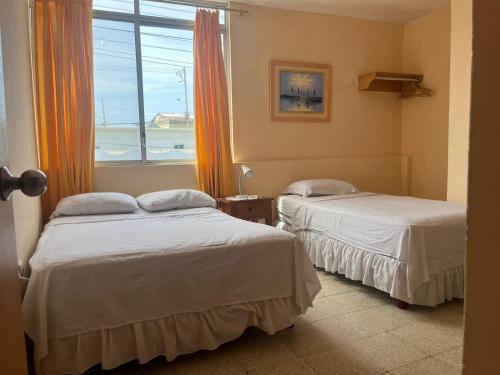Postel nebo postele na pokoji v ubytování Hotel Mileto