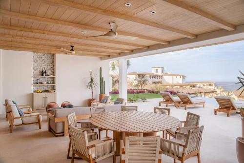 an outdoor patio with a table and chairs at Four Seasons Resort Cabo Del Sol in El Tule