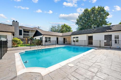 a swimming pool in the backyard of a house at Modern & Spacious 1BR Haven near Galleria in Houston