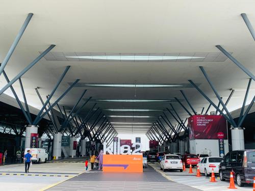 a parking lot with cars parked in it at Core Soho Suites Kota Warisan Sepang KLIA Airport Free Wifi by BKA LEGACY in Sepang