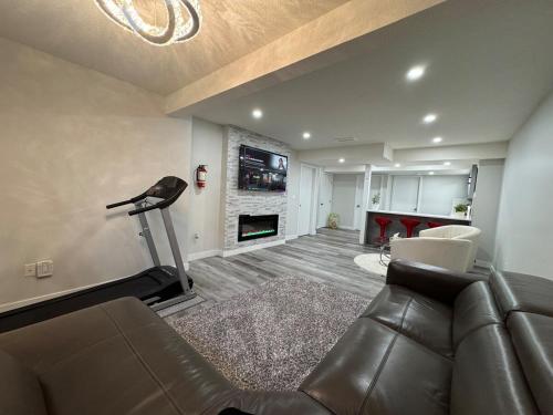 a living room with a couch and a fireplace at HansBnB near Airport in Calgary