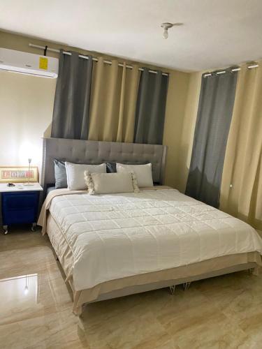 Postel nebo postele na pokoji v ubytování Luxury Apartment By Merengue House
