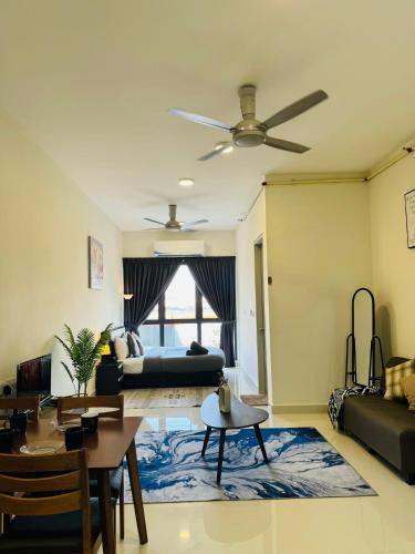 a living room with a couch and a ceiling fan at Core Soho Suites Kota Warisan Sepang KLIA Airport Free Wifi by BKA LEGACY in Sepang