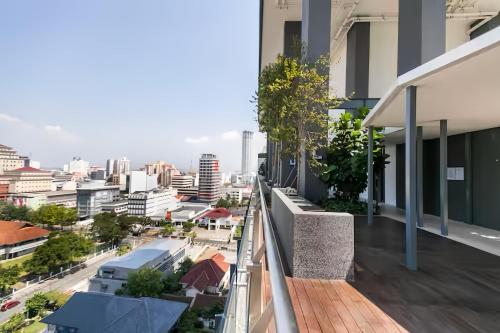 an apartment balcony with a view of a city at Tropicana 218 Macalister Penang in George Town