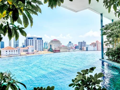 a swimming pool with a view of the city at Tropicana 218 Macalister Penang in George Town