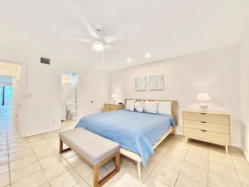 a bedroom with a bed and a ceiling fan at Crystal Cove Sapphire Beach - Spacious Condo, Pool Tennis WiFi in East End