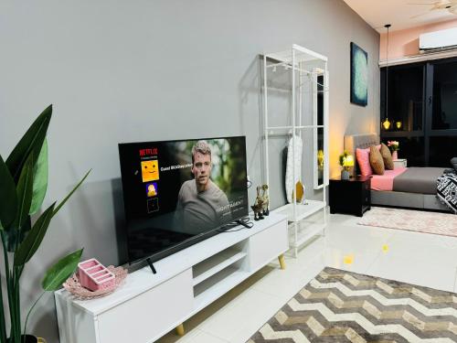 a living room with a large flat screen tv at Core Soho Suites Kota Warisan Sepang KLIA Airport Free Wifi by BKA LEGACY in Sepang