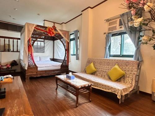 a living room with a couch and a mirror at Old Street Seaview Homestay in Jiufen