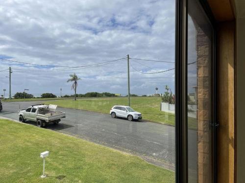 a view of a street with a truck and a car at Drift at Harrington in Harrington