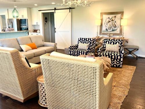 a living room with wicker chairs and a couch at 2420 Seabrook Island Rd in Johns Island