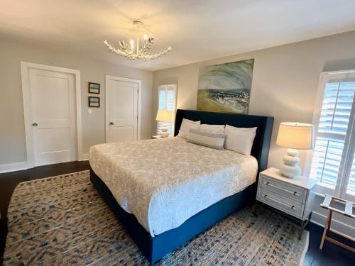 a bedroom with a bed and a chandelier at 2420 Seabrook Island Rd in Johns Island