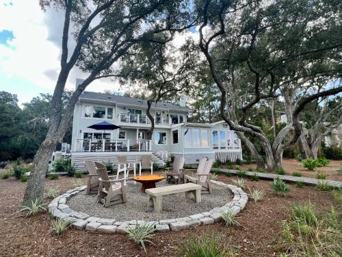 a house with a table and chairs in front of it at 2420 Seabrook Island Rd in Johns Island