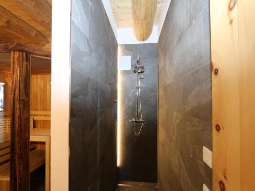 a bathroom with a black wall at Chalet in Wildkogel with Ski-In Ski-Out in Bramberg am Wildkogel