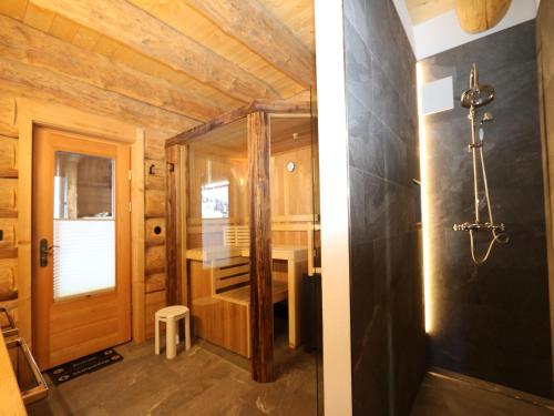 a small bathroom with a desk and a door at Chalet in Wildkogel with Ski-In Ski-Out in Bramberg am Wildkogel