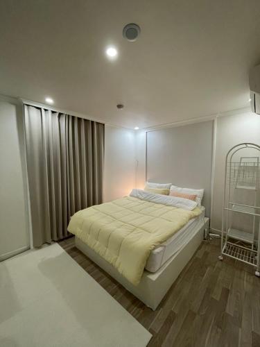 Ένα ή περισσότερα κρεβάτια σε δωμάτιο στο Stay The Meomuleum Sanbon