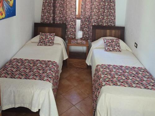 Postel nebo postele na pokoji v ubytování Villas Kalimba