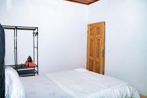 Una cama o camas en una habitación de L'Élégance Urbaine