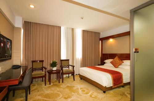 Postel nebo postele na pokoji v ubytování Shanghai YUHANG Hotel