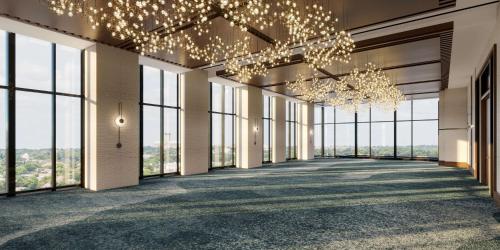 a hallway with large windows and chandeliers at Hilton Arlington Rosslyn The Key in Arlington