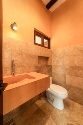 a bathroom with a tub and a toilet and a sink at Entire 3bd Home Villa-Home-with Private Pool and Patio in Tesoco