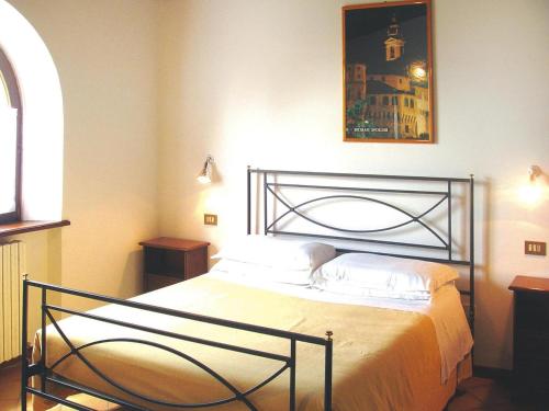 A bed or beds in a room at Apartment in Residence La Ginestra in Montelparo