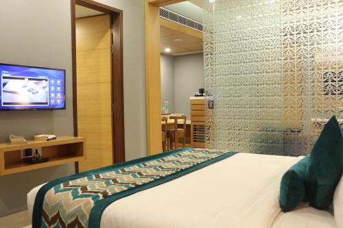 Ένα ή περισσότερα κρεβάτια σε δωμάτιο στο Shree Kanak Udaipur