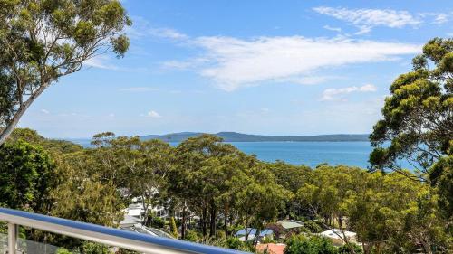 a view of the ocean from the balcony of a house at Water Views on Wallawa in Nelson Bay