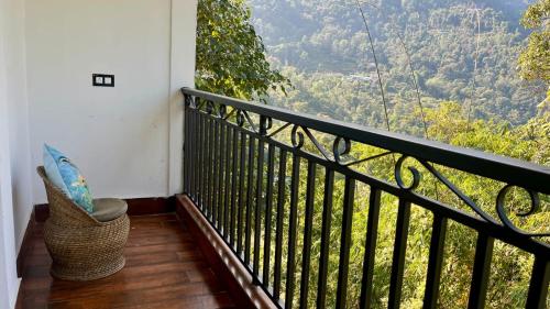 a balcony with a view of a mountain at Miknaon Farmstay in Pedong