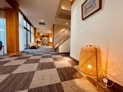a hallway with a luggage cart in a building at 楓リゾート鬼怒川温泉 优雅宽敞的日式独栋旅馆 in Nikko